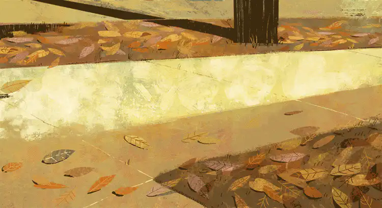 Quelques feuilles s'envolent sur un chemin