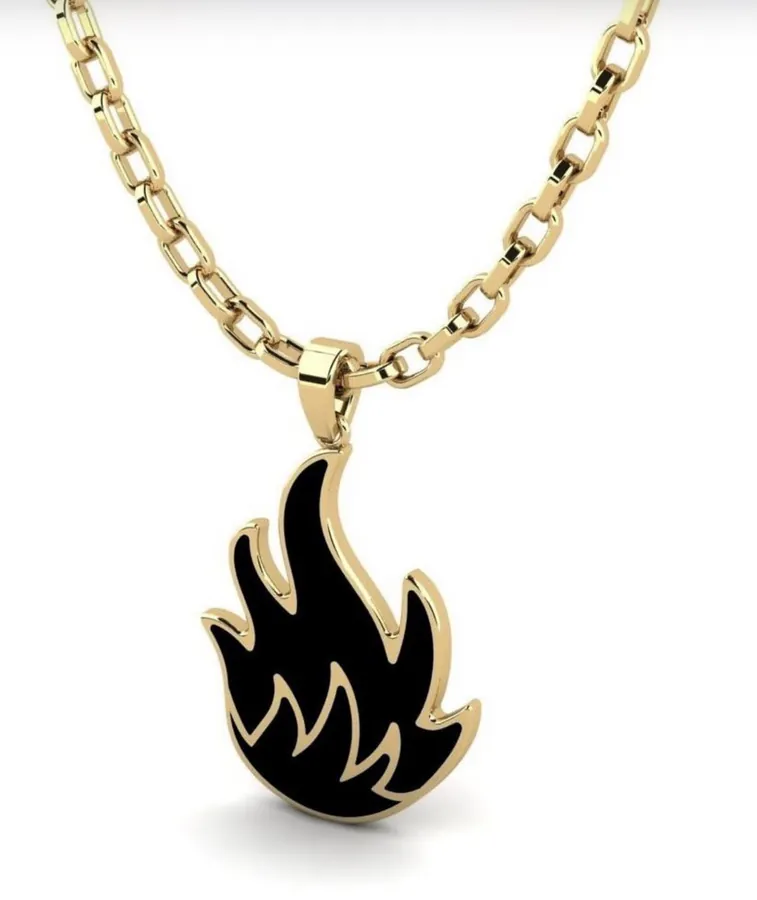 pendentif doré et noir en forme de flamme