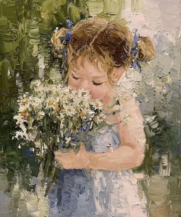 petite fille qui sent des fleurs