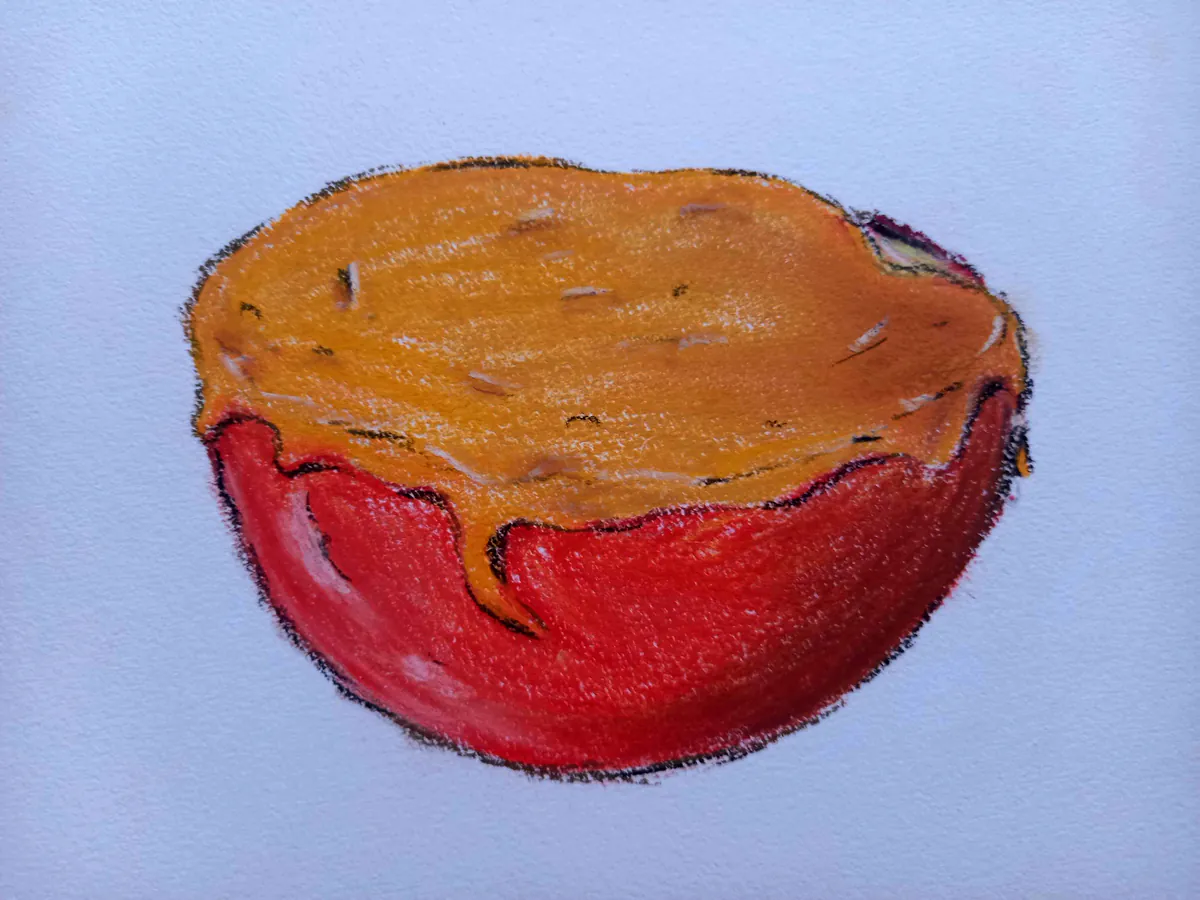 Dessin à la pastel représentant une pomme coupée en deux et couverte de caramel